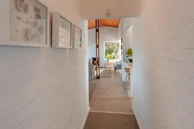 a hallway of a house with white walls at Views Views Views in Hermanus