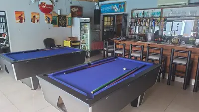 two pool tables in a room with a bar at Robert's Place Paarl in Paarl