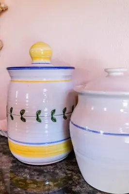 two white vases sitting next to each other on a counter at Die Wasbak in Greyton