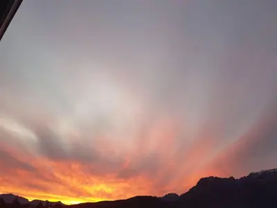 a sunset over the mountains with a cloudy sky at Worcester the Karoo Guest Room in Worcester