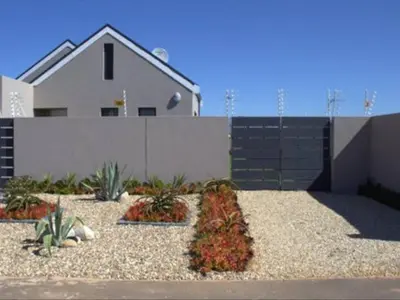 a house with a garden with plants in front of it at Worcester the Karoo Guest Room in Worcester