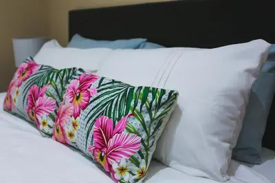 a pillow sitting on top of a bed at Arlogenix in Durbanville