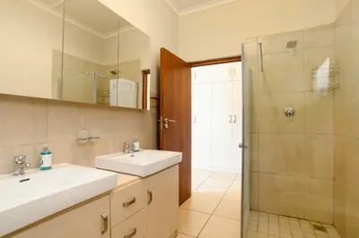 a bathroom with a sink and a shower at Vredehoek Guest Farm in Breerivier