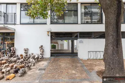 a group of pigeons standing outside of a building at CONCORD APARTMENTS Unit 1 in Stellenbosch