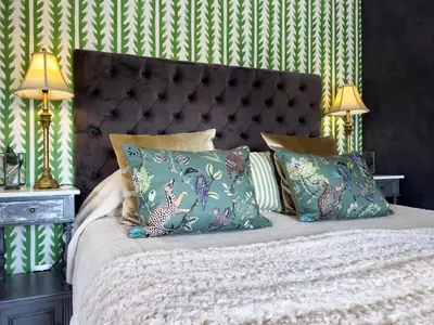 a bedroom with a large bed with two pillows at Baruch Guest House Rhodes in Stellenbosch