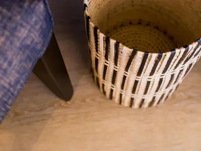 a wicker basket sitting on top of a wooden floor at Maison Montagne in Franschhoek