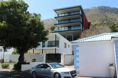 a car parked in front of a house at Redrock Ocean View Villa in Cape Town