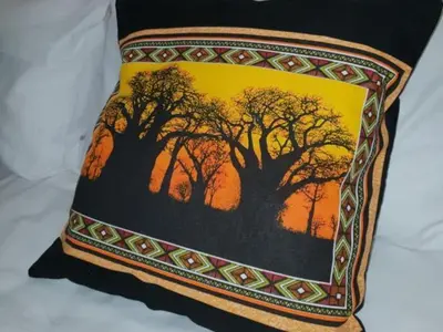 a pillow with a picture of a tree on it at Lyronne Guest house, Shuttle and Tours in Cape Town