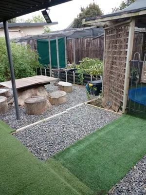 a backyard with a picnic table and some grass at 33onGill in Cape Town