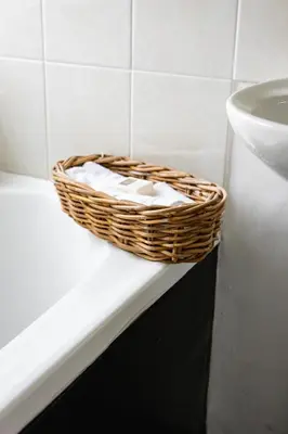 a basket sitting on a bathroom counter next to a sink at Villa Le Roc Kleinmond Accommodation in Kleinmond