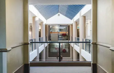 a hallway in a building with a glass corridor at Strand Pavilion in Strand