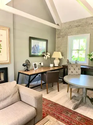 a living room with a couch and a table at One Oak Guest House in Somerset West