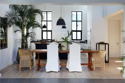 a dining room with a table and chairs at McFarlane Residence by Top Destinations Rentals in Hermanus