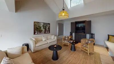 a living room with a couch and a table at McFarlane Residence by Top Destinations Rentals in Hermanus