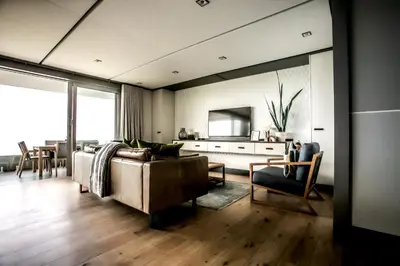 a living room with a couch and a table at Bayview 203 in Hermanus