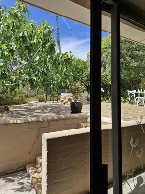 a view of a patio from the window of a house at Goedehoop in Somerset West