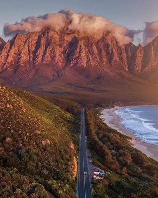 an aerial view of a road in front of a mountain at OCEANPEARL 209 in Strand