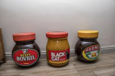 three jars of honey sitting next to each other at Apartment Claudia in Stellenbosch