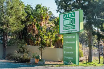 a sign for a golf course in front of a house at ATKV Goudini Spa in Rawsonville