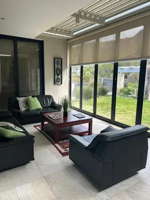 a living room with couches and a coffee table at House Vos in Hermanus