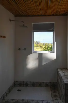 a bathroom with a window in a white room at Eikehof Farm in Worcester