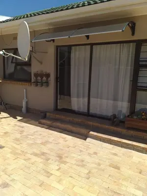 a view of a house with a large window at 19 on Micro Avenue in Strand