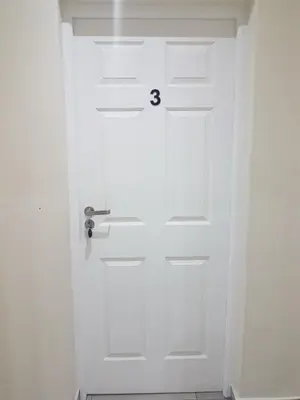 a white door with the number eight on it at Sharon's House: Modern Self-Catering rooms in Cape Town