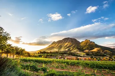 a view of a mountain under a cloudy sky at Villa Helderberg in Somerset West