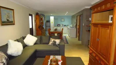 a living room with a couch and a table at Sonvanger 2 in Paarl