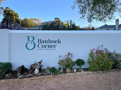 a sign for a garden center with plants at Banhoek Corner Guesthouse in Stellenbosch