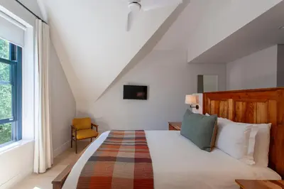 a bedroom with a bed in a attic at Minserie Collection in Stellenbosch