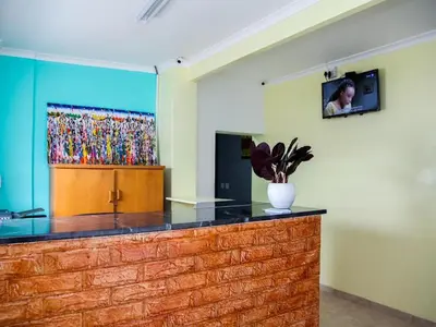 a counter in a room with a painting on the wall at Relaxing guest House in The heart of Ndabeni in Cape Town