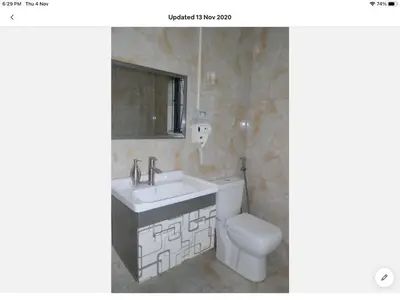a bathroom with a sink and a toilet at Tia Maria House in Cape Town