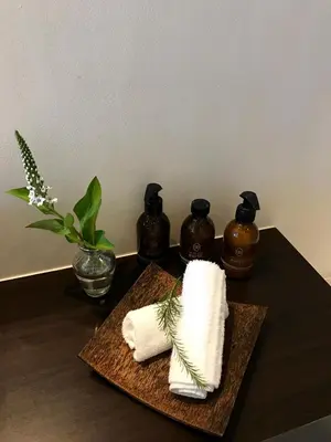 a table with two towels and two bottles of syrup at Cape Vermeer in Somerset West