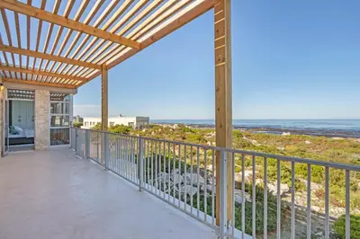 a porch with a view of the ocean at Blueview on Silversand in Clareport