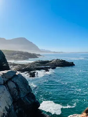 a view of the ocean from a rocky beach at Villa Voigt in Hermanus