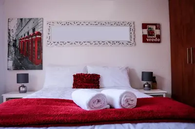 a bedroom with a bed with two towels on it at La Grâce, Durbanville in Cape Town