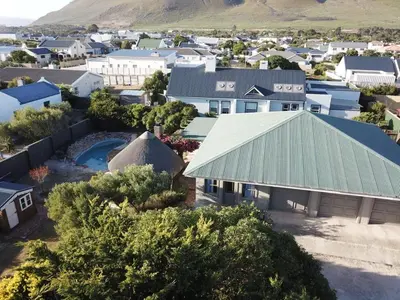 an aerial view of a small town with a building at Olive Cottage in Hermanus
