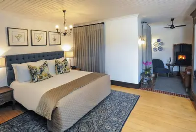 a bedroom with a large bed in a room at Southern Sun de Wagen in Stellenbosch