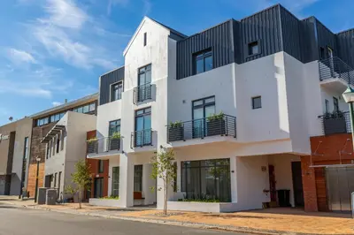 an apartment building with black and white facades at Hotel Krige in Stellenbosch