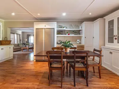 a kitchen and dining room with a table and chairs at Hoogwater Farmhouse in Wolseley