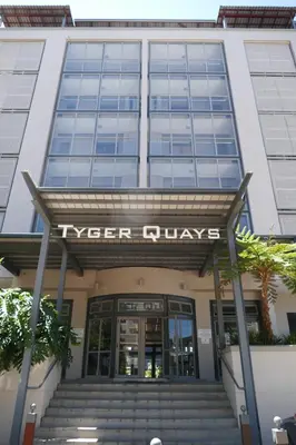 a building with a sign that reads tyger drives at Little Venice Self Catering in Bellville