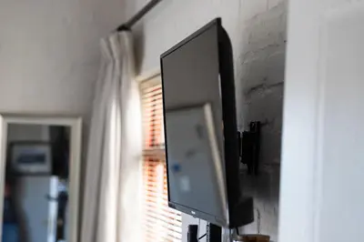 a flat screen tv hanging on a wall at 17Peppertree in Cape Town