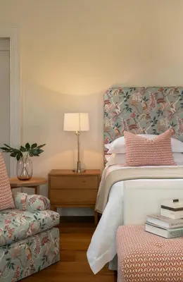 a bedroom with a bed and a chair and a lamp at Brookdale Estate - Manor House in Paarl