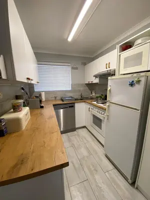 a kitchen with white appliances and a white refrigerator at CView in Hermanus