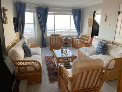 a living room with couches and a table at CView in Hermanus