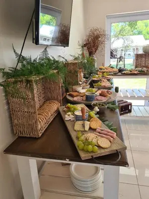 a table with many different types of food on it at Cape Winelands Business Villas in Joostenberg Vlakte