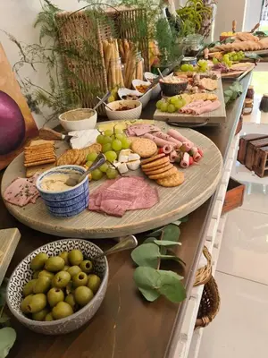 a buffet with many plates of food on a table at Cape Winelands Business Villas in Joostenberg Vlakte
