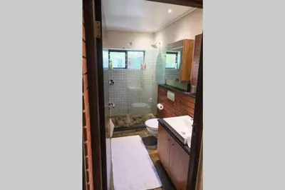 a bathroom with a toilet and a sink at Home in Cape Town-The Homestead in Stellenbosch