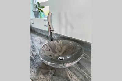 a bathroom sink with a metal bowl on a counter at Beach & Mountain Retreat within a UNESCO Biosphere in Rooiels